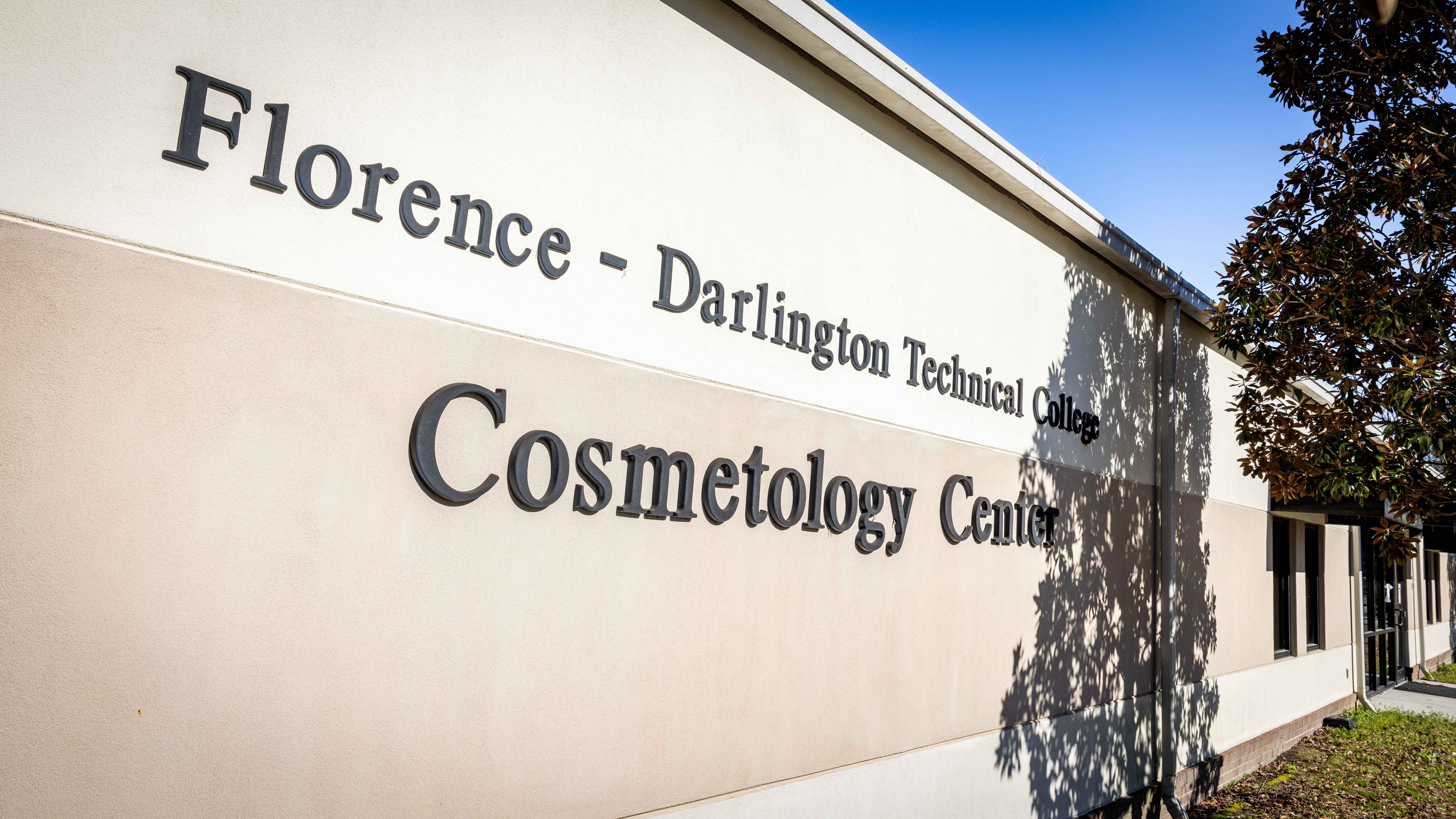 An exterior photograph of the Cosmetology School.
