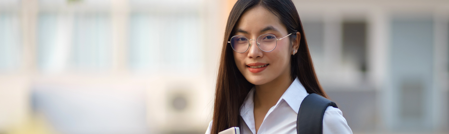 A student smiles