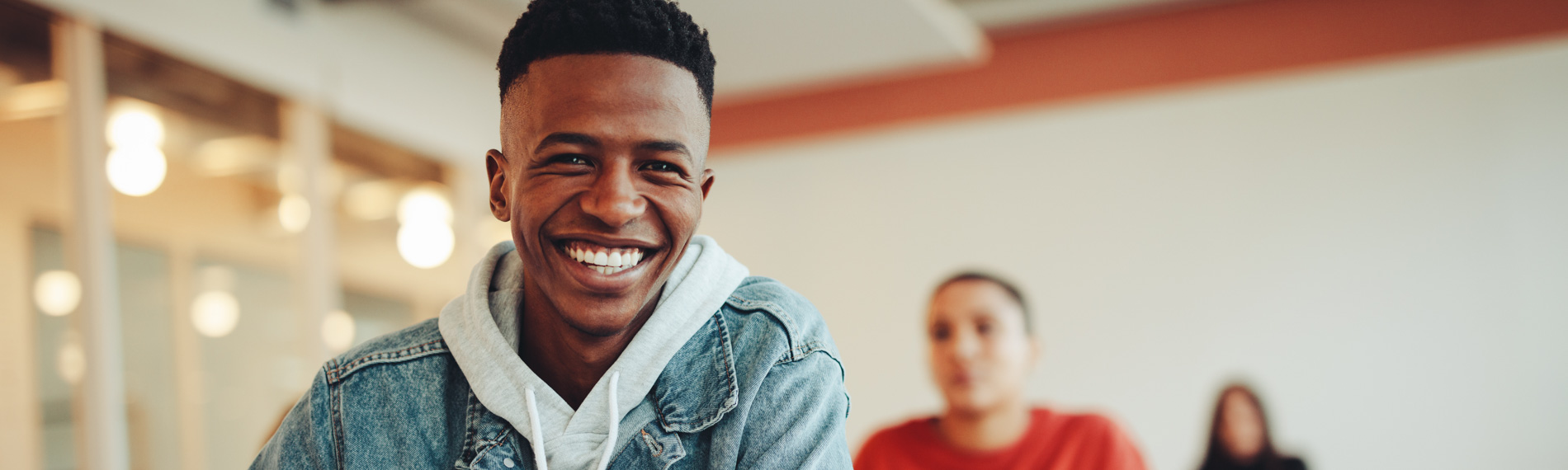 A student smiles