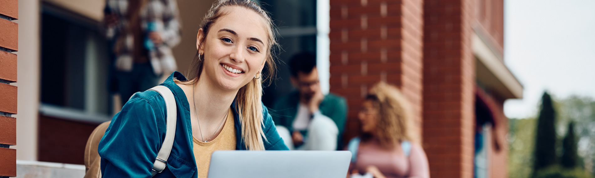 A student smiles