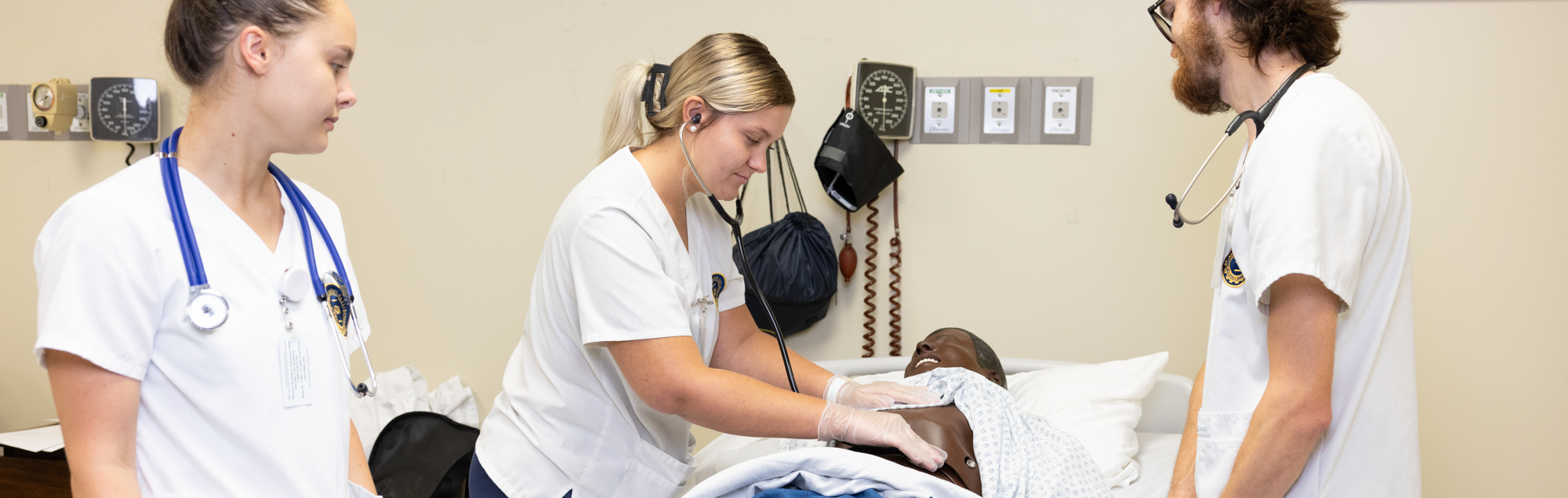 An FDTC practical nursing student practices technique in a hospital classroom