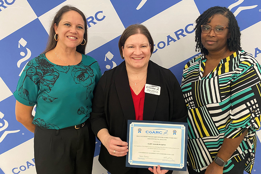 Staff from the Respiratory Care Program and Allied Health Care accept an award