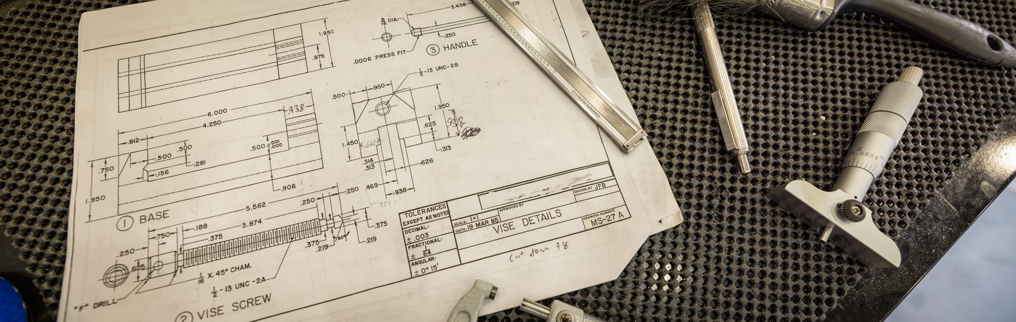 electrical schematics and tools on a table