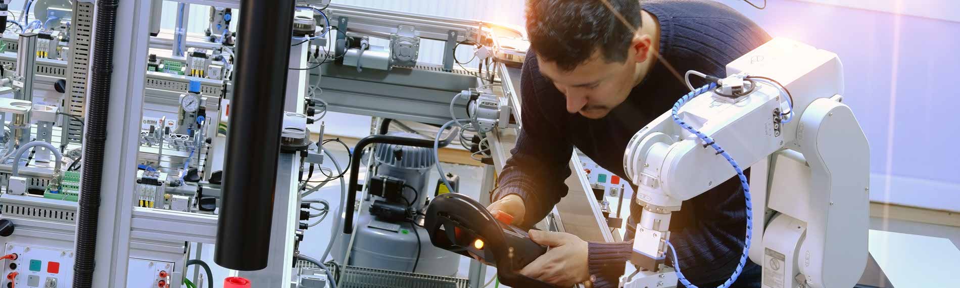 A programmer works on Control Logix equipment.