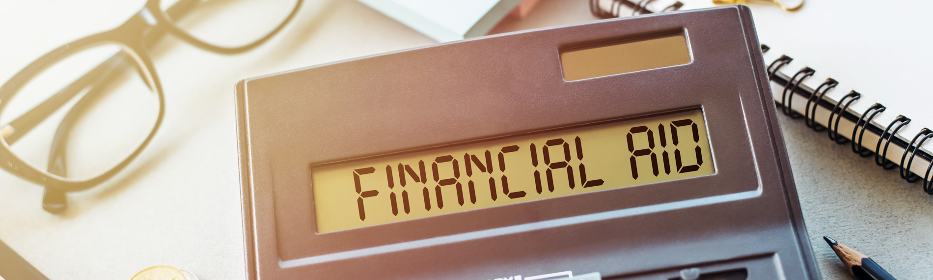 An image of a calculator displaying financial aid
